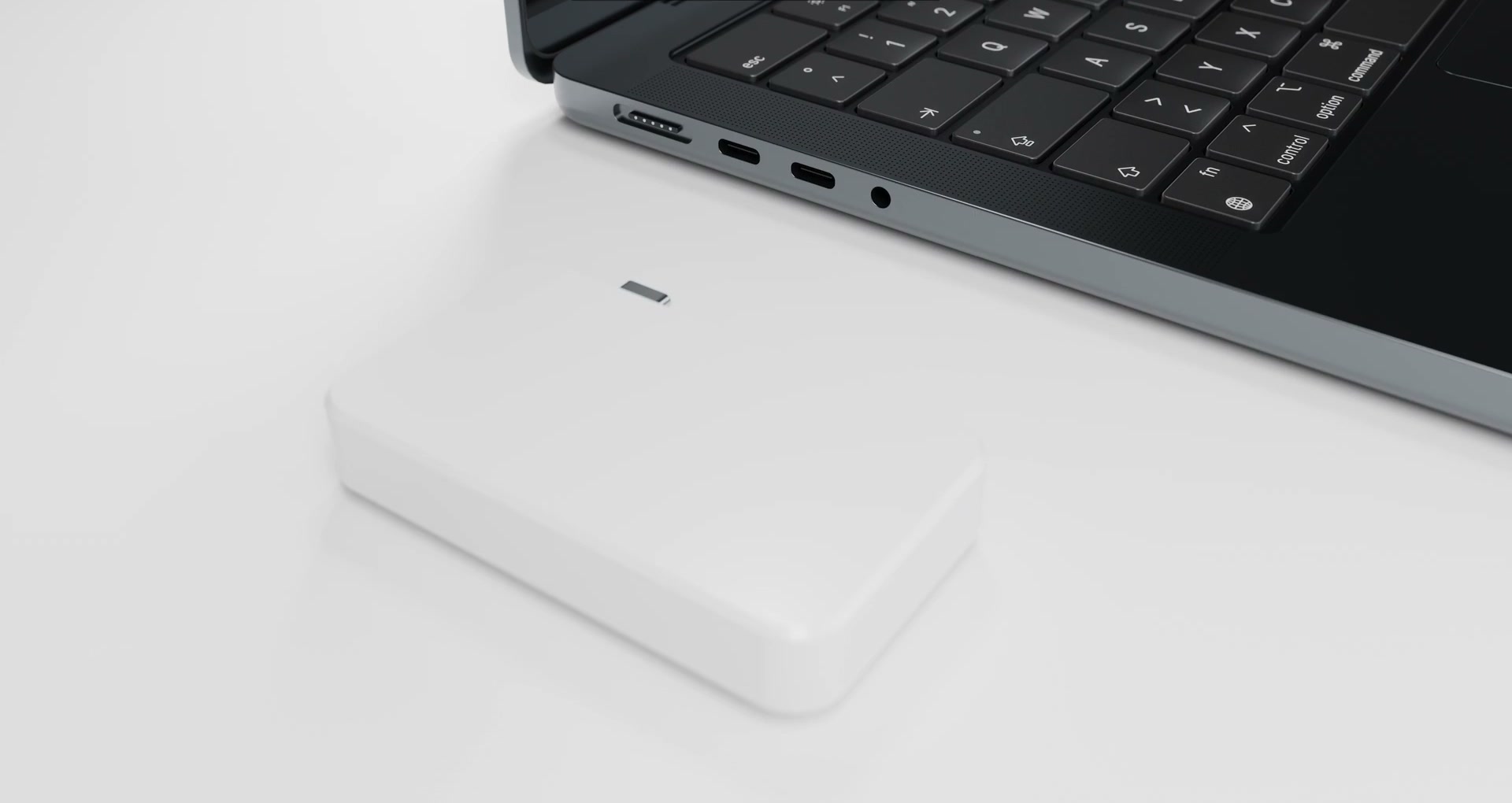 Relay R1 plugging into the USB-C port of a 2024 MacBook Pro.